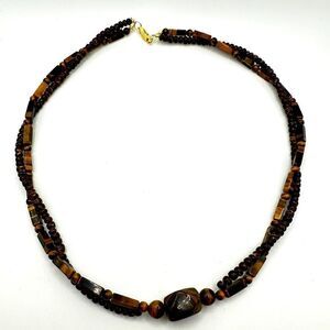 21" Revived Tigers Eye and wood beaded twisted necklace with gold tone hardware!